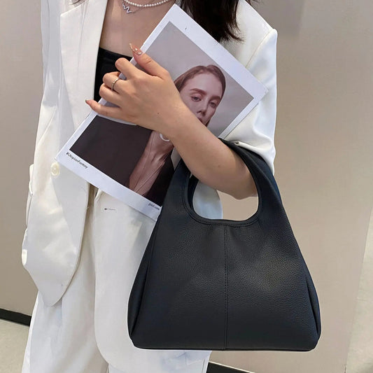 Women’s black leather tote — spacious yet sleek for office and city