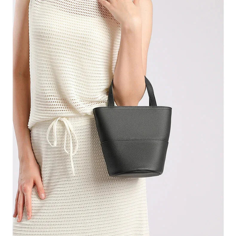 Belmont leather bucket bag — worn crossbody/over the shoulder