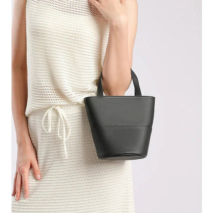 Belmont leather bucket bag — worn crossbody/over the shoulder