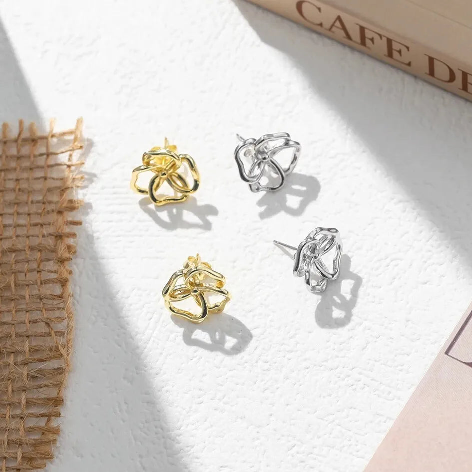 Gold openwork flower earrings lightweight design