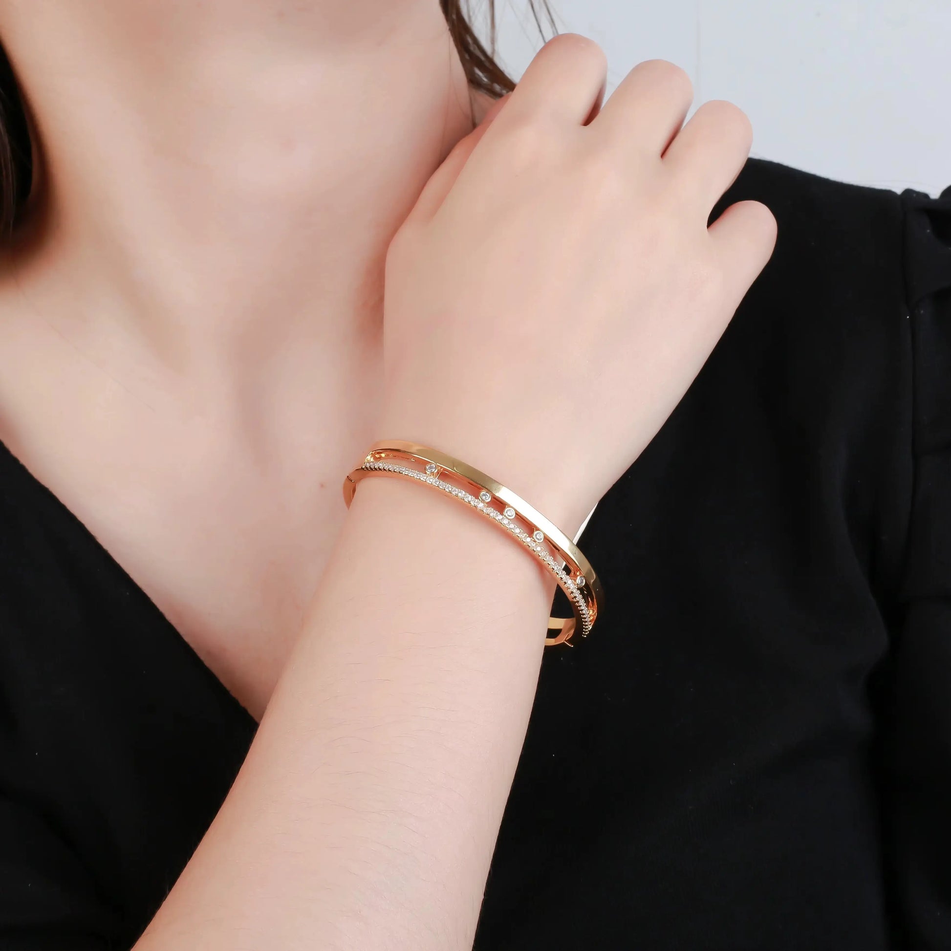 minimalist gold plated slider bracelet with cubic zirconia detail