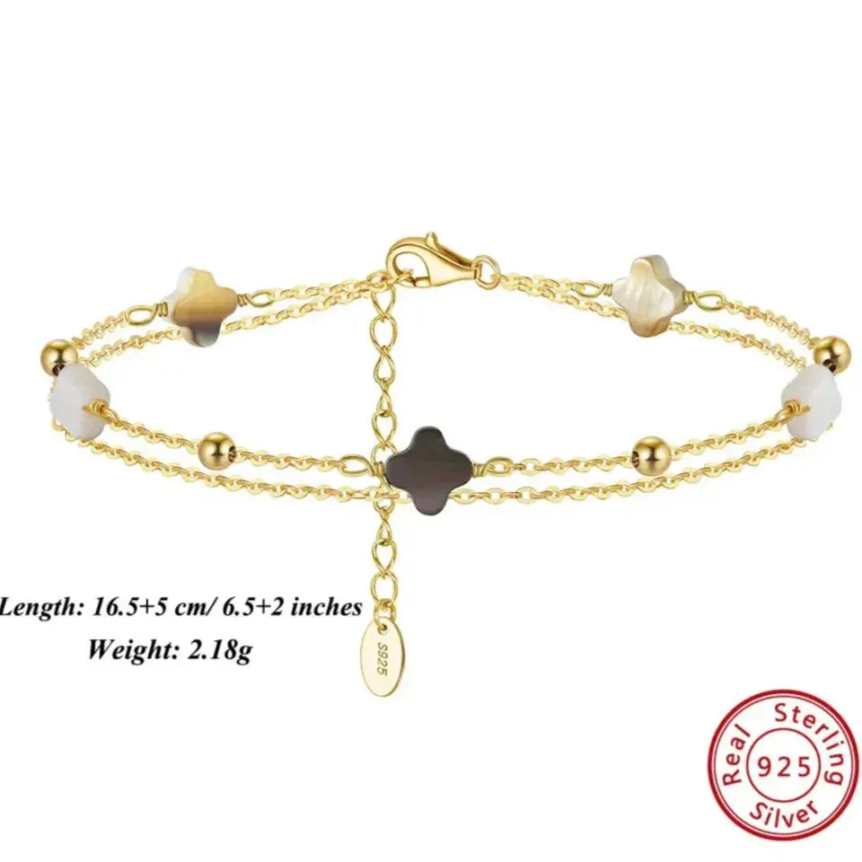 gold-finish four-leaf clover bracelet with mother of pearl detail
