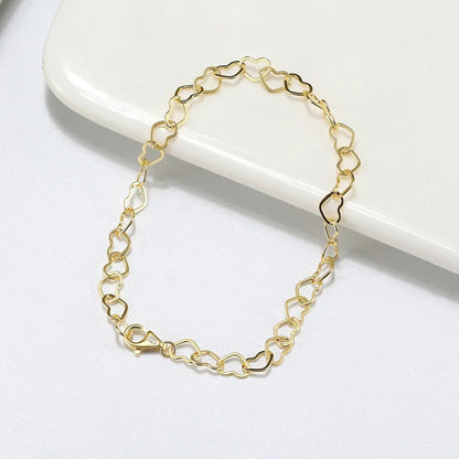 delicate heart chain bracelet polished gold plated finish