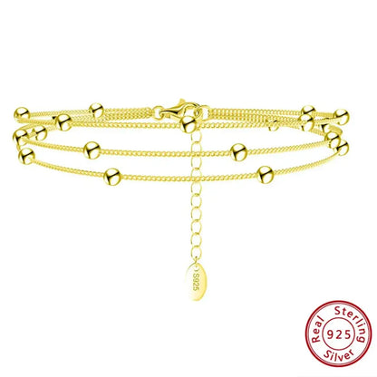 gold-tone triple-layer bracelet polished satellite chain