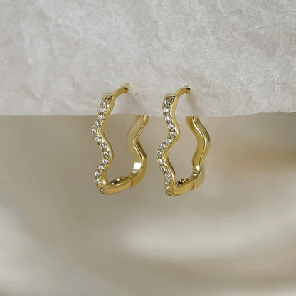 gold plated sterling silver wave hoop earrings pair display