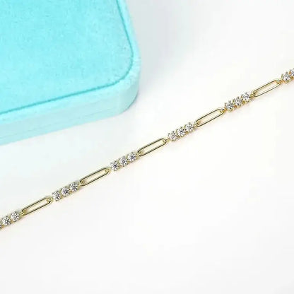 paper clip link bracelet gold close-up with moissanite