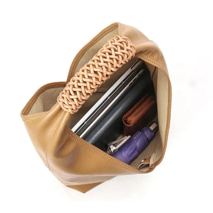 Leather bucket bag — structured silhouette and spacious interior
