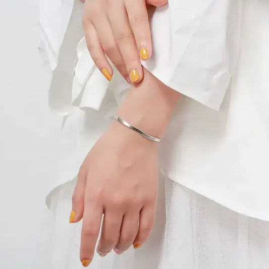 silver herringbone bracelet featuring a fluid snake-style chain