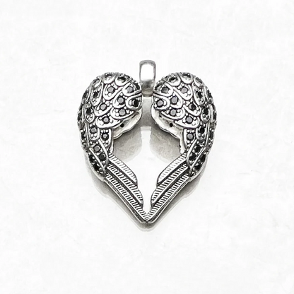 Winged heart pendant in 925 sterling silver on white background