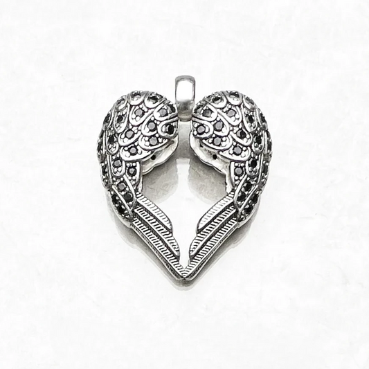 Winged heart pendant in 925 sterling silver on white background