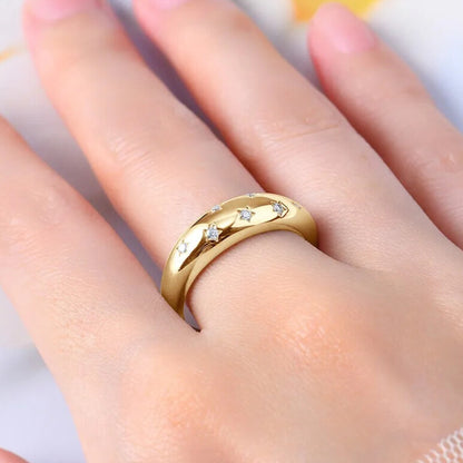 Women’s statement moissanite wedding band stacked with rings