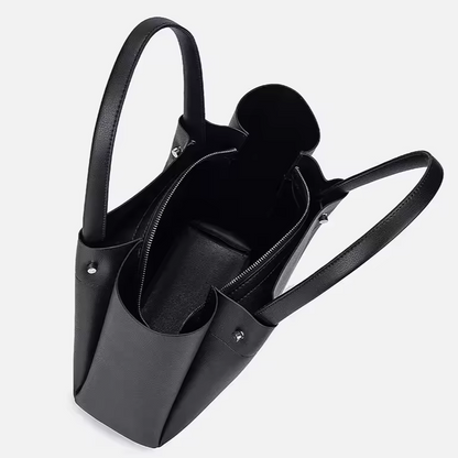 Spacious black tote backpack displayed open showing interior space