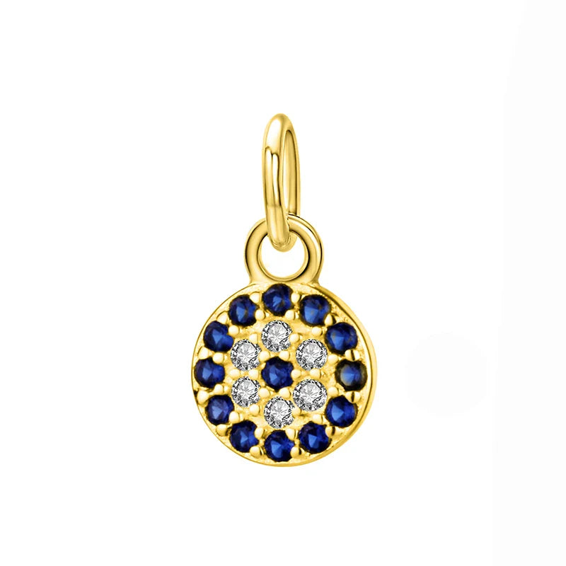 Dainty 6 mm silver and gold evil eye pendant — close-up on cubic zirconia
