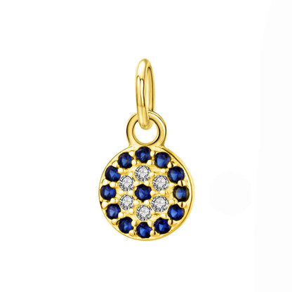 Dainty 6 mm silver and gold evil eye pendant — close-up on cubic zirconia