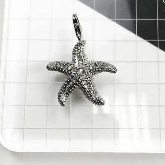 silver starfish pendant with cubic zirconia pavé close up