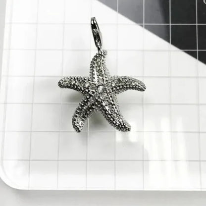 silver starfish pendant with cubic zirconia pavé close up