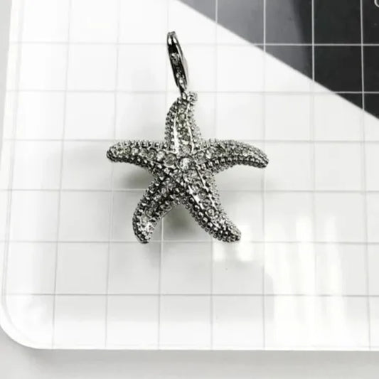 silver starfish pendant with cubic zirconia pavé close up