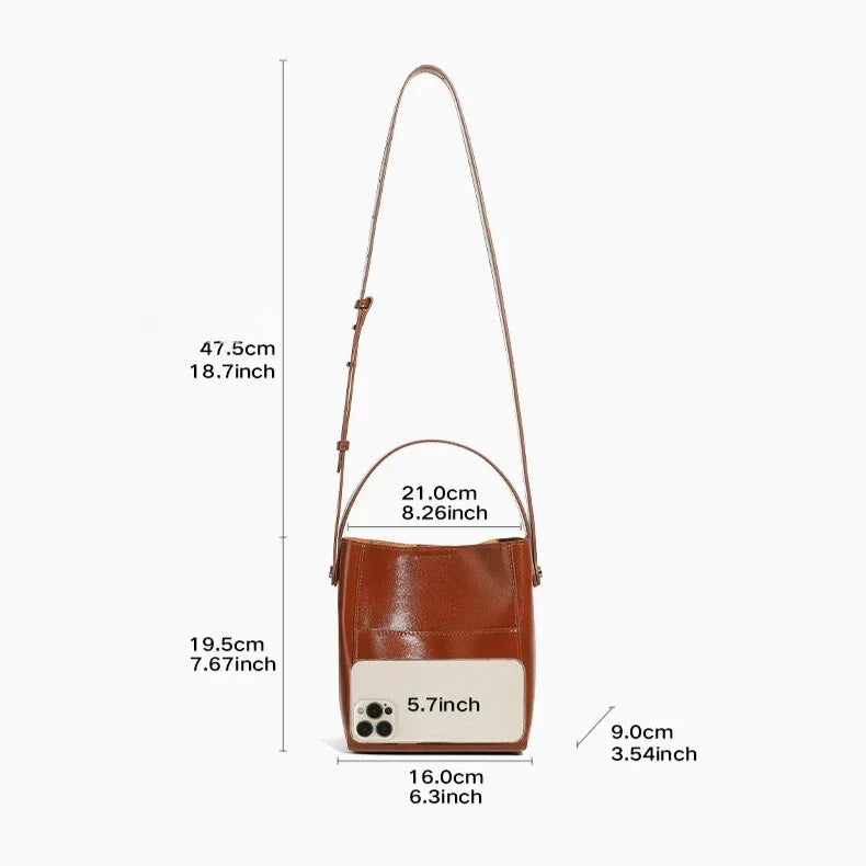 adjustable shoulder strap detail of alira brown genuine leather bucket crossbody