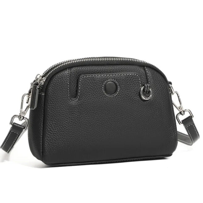 Soft genuine black leather with compact structured silhouette — women’s mini bag