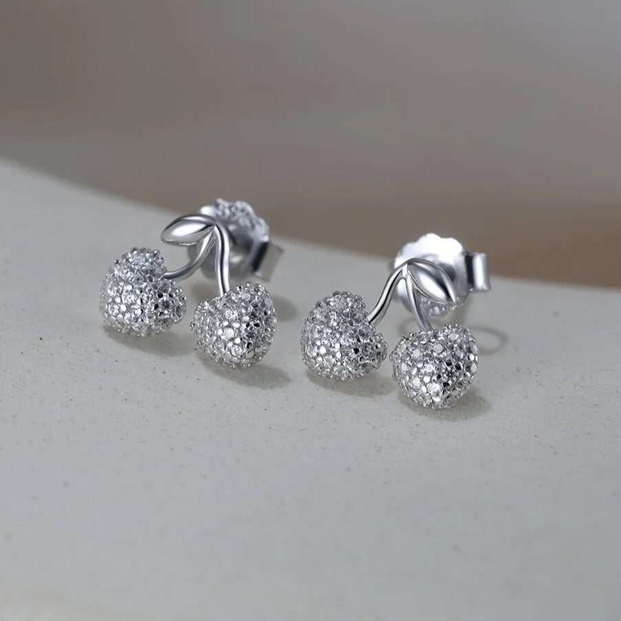 close up of cherry stud earring in sterling silver polished finish