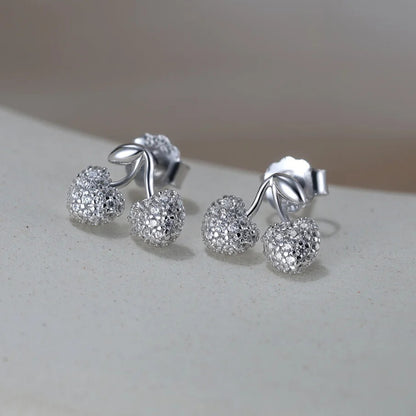 close up of cherry stud earring in sterling silver polished finish