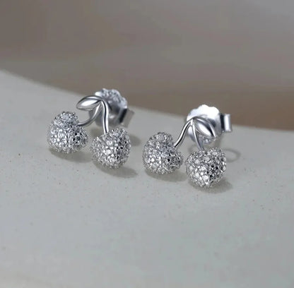 elegant silver cherry studs lifestyle photo