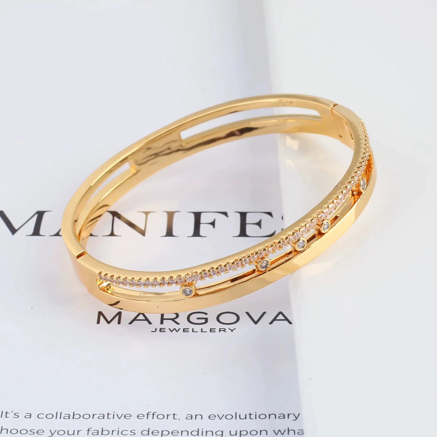 minimalist gold plated slider bracelet with cubic zirconia detail