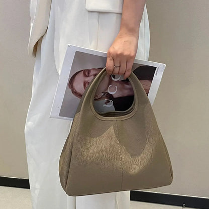 Leather crossbody tote — organised interior with slip & zip pockets