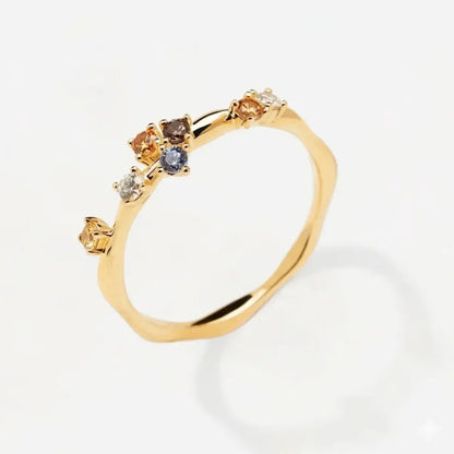 Zircon half eternity ring in 925 sterling silver with colourful stones across the top.