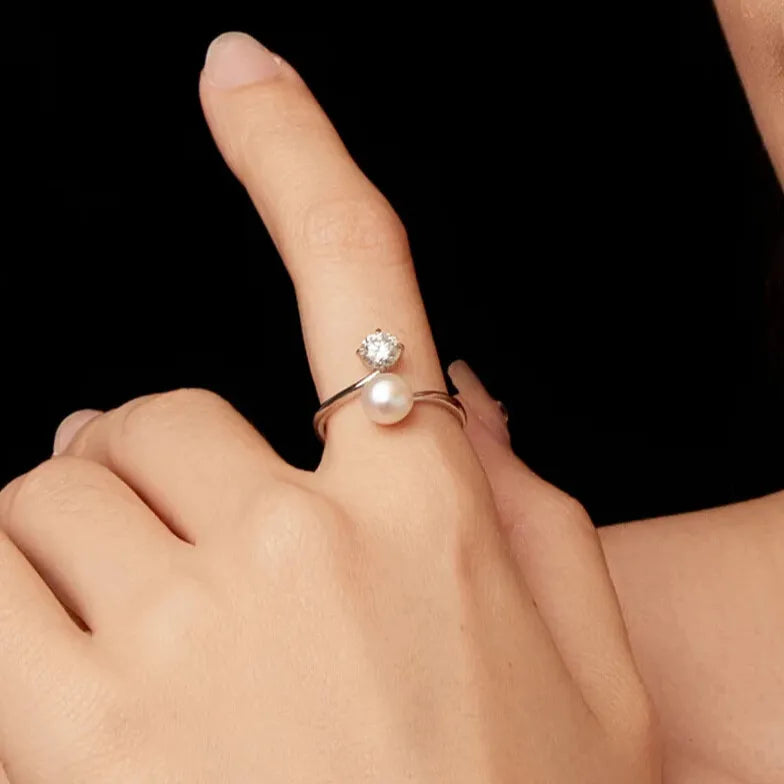 modern moissanite and pearl ring symbol of timeless elegance