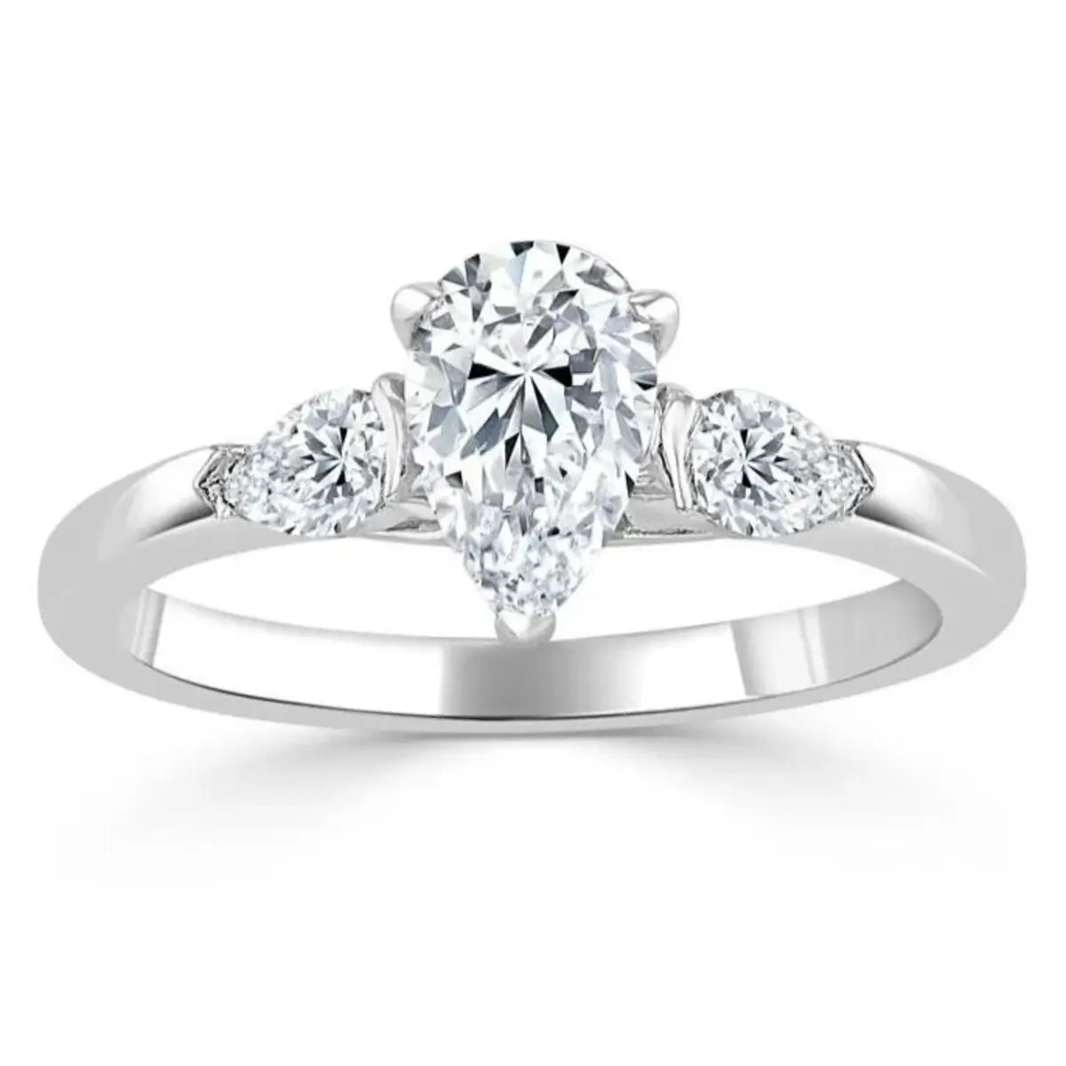 Close-up of a teardrop moissanite centre stone 1ct and shimmering cubic zirconia side stones in a polished sterling silver setting.