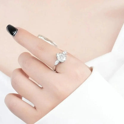 1 carat pear cut moissanite ring on hand with refined sparkle.