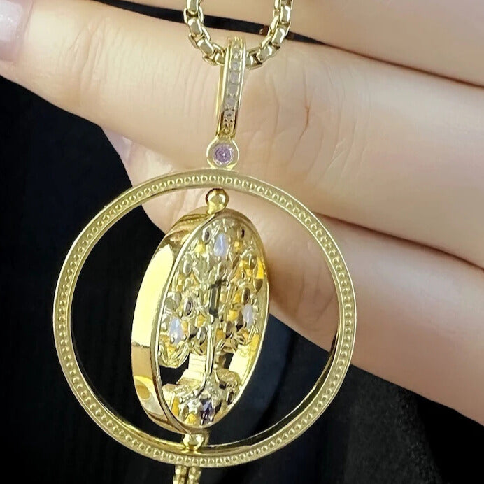 Rotating tree of life charm with multicolour zircon stones