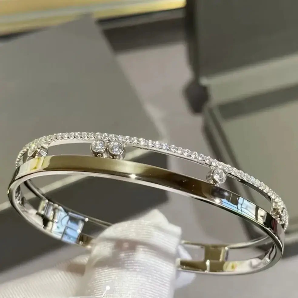 close-up of cubic zirconia stones gliding on sterling silver bracelet