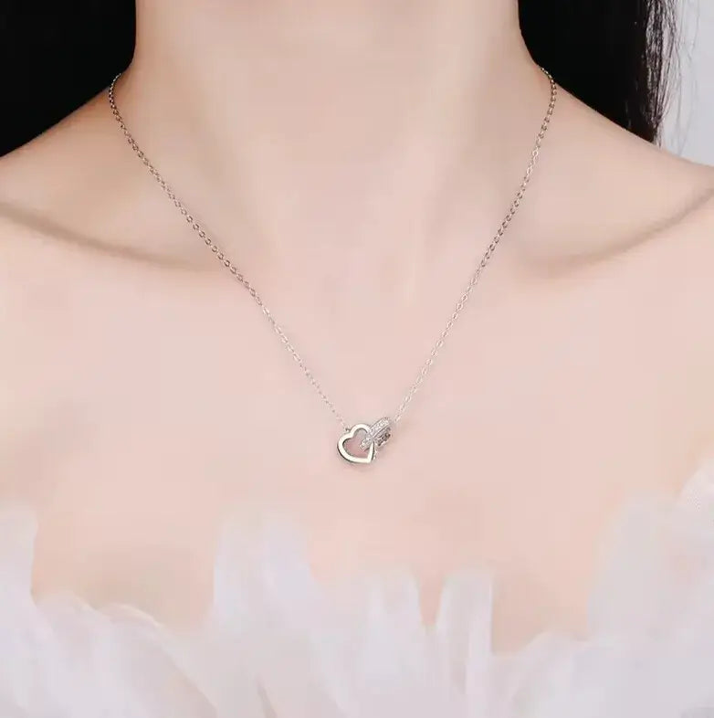 delicate sterling silver heart pendant with moissanite