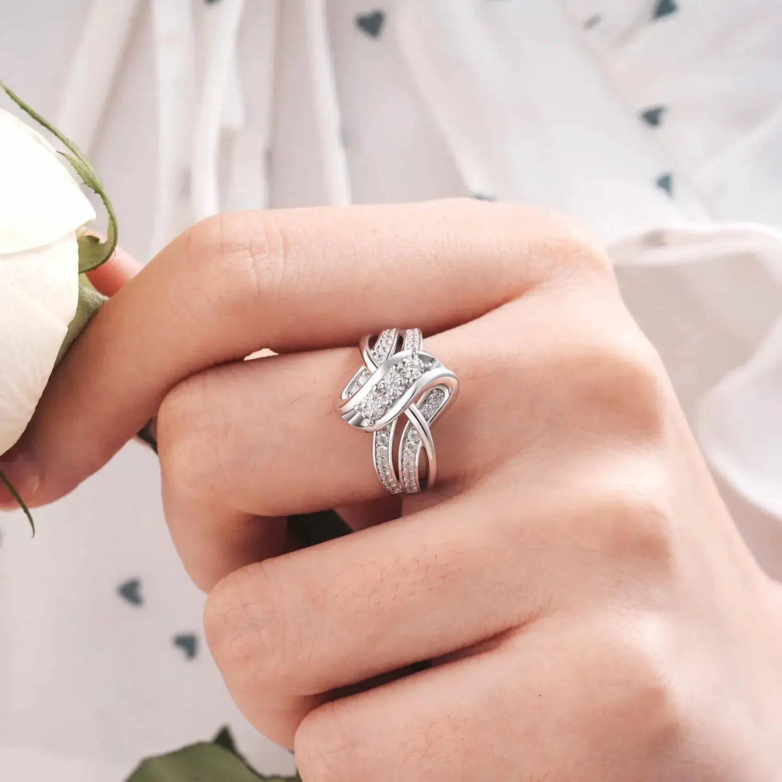 silver knot ring worn on hand