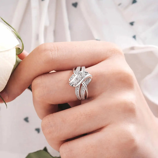 silver knot ring worn on hand