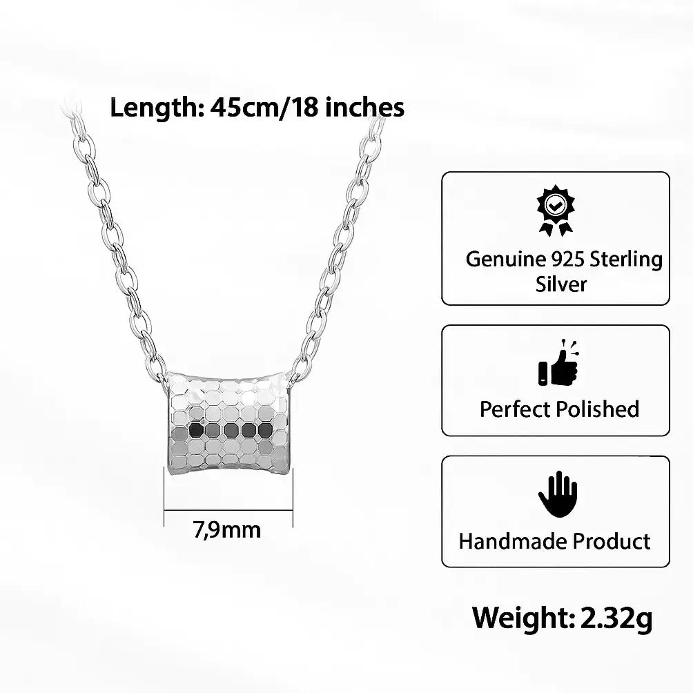 vintage-inspired silver pendant detail