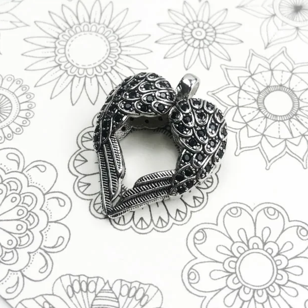 Angel wings heart pendant showcasing high-polish finish