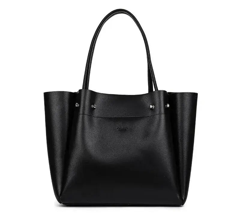 black tote bag worn as shoulder bag for everyday use