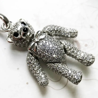 close-up of silver bear charm for necklaces