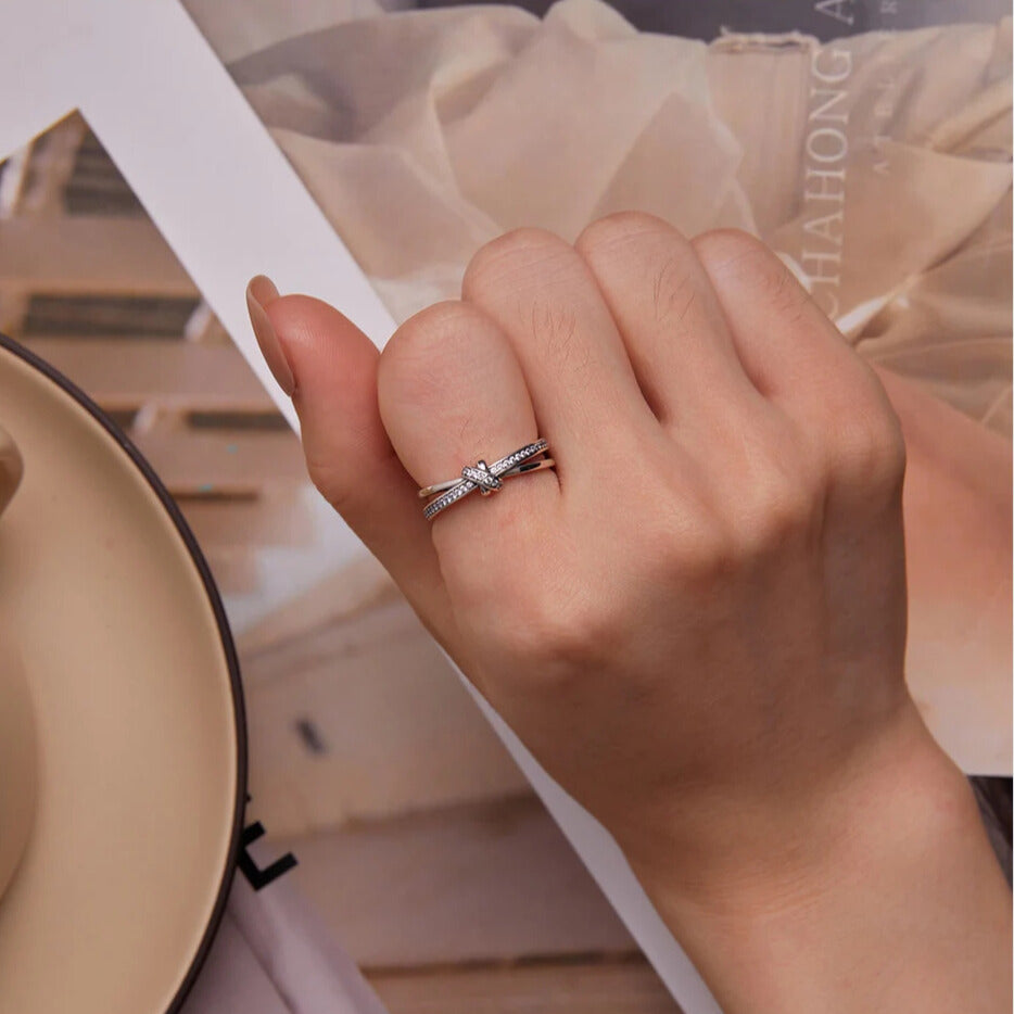 Women’s sterling silver knot ring, round CZ centre stone