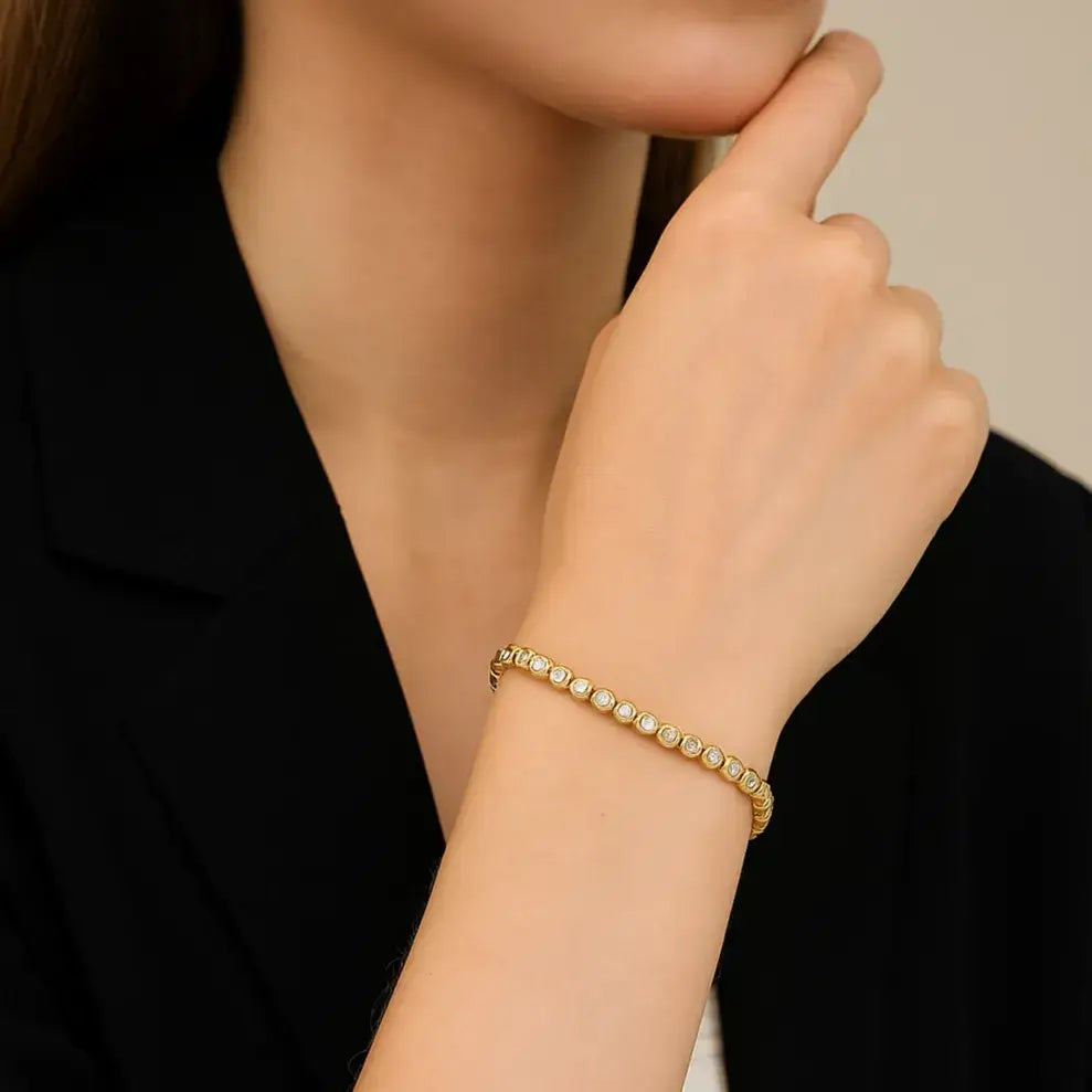 elegant woman wearing gold tennis bracelet – Elegantia Jewellery