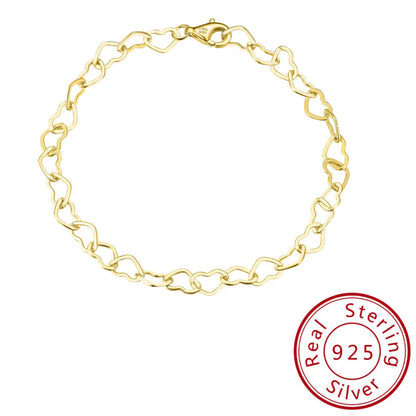 close up of gold heart link chain bracelet trendy womens jewellery