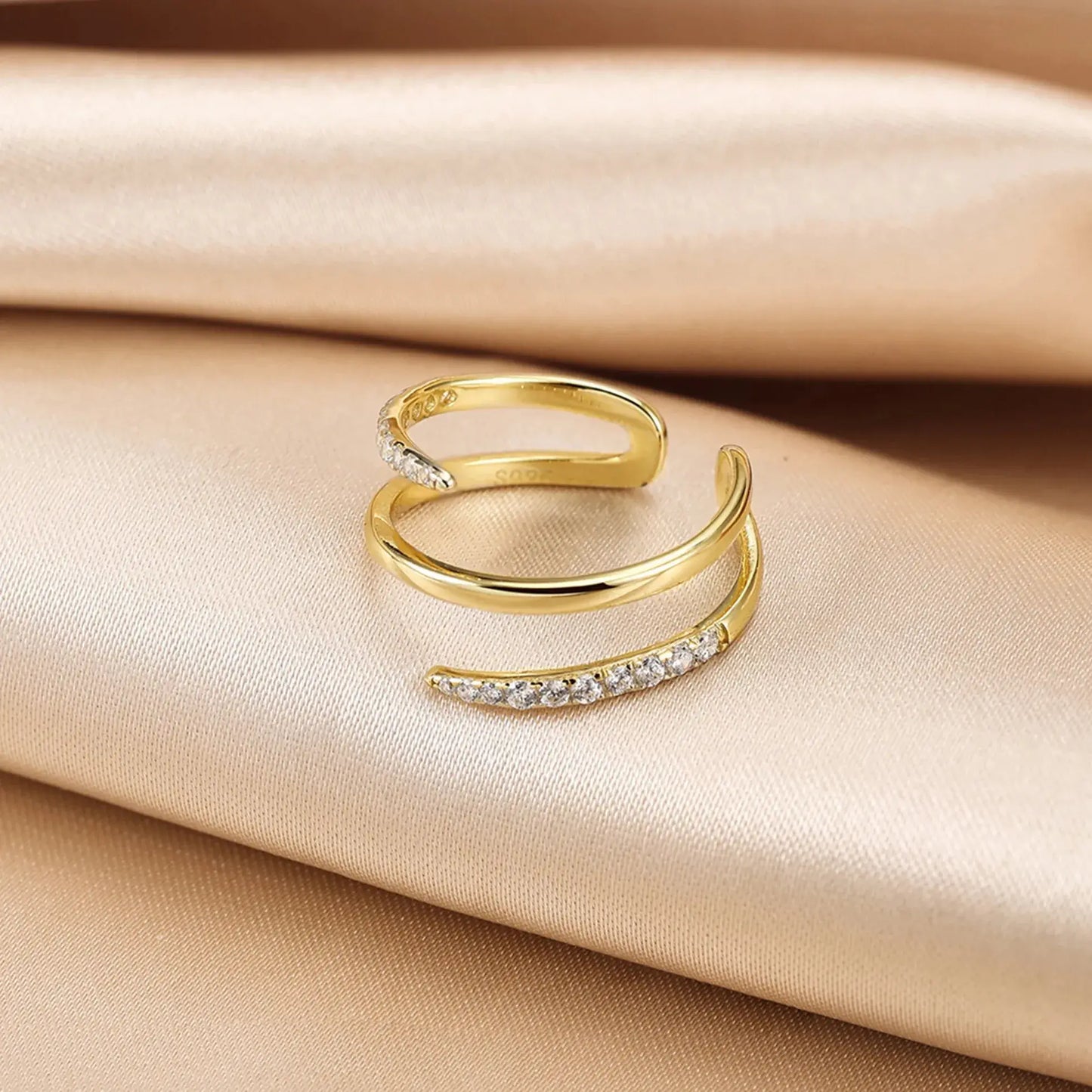 minimalist three-layer gold ring displayed upright