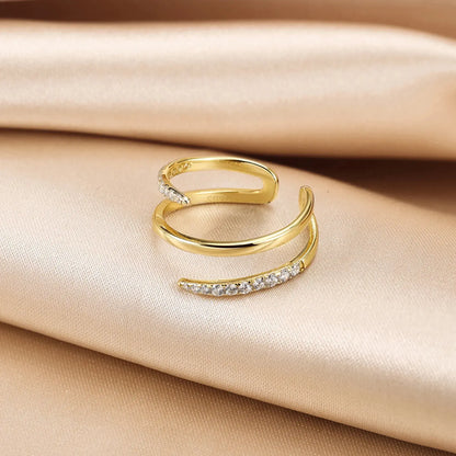 minimalist three-layer gold ring displayed upright