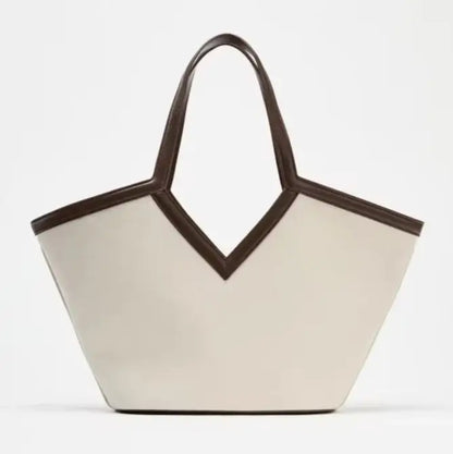 VersaCharm canvas tote bag worn on shoulder in everyday outfit