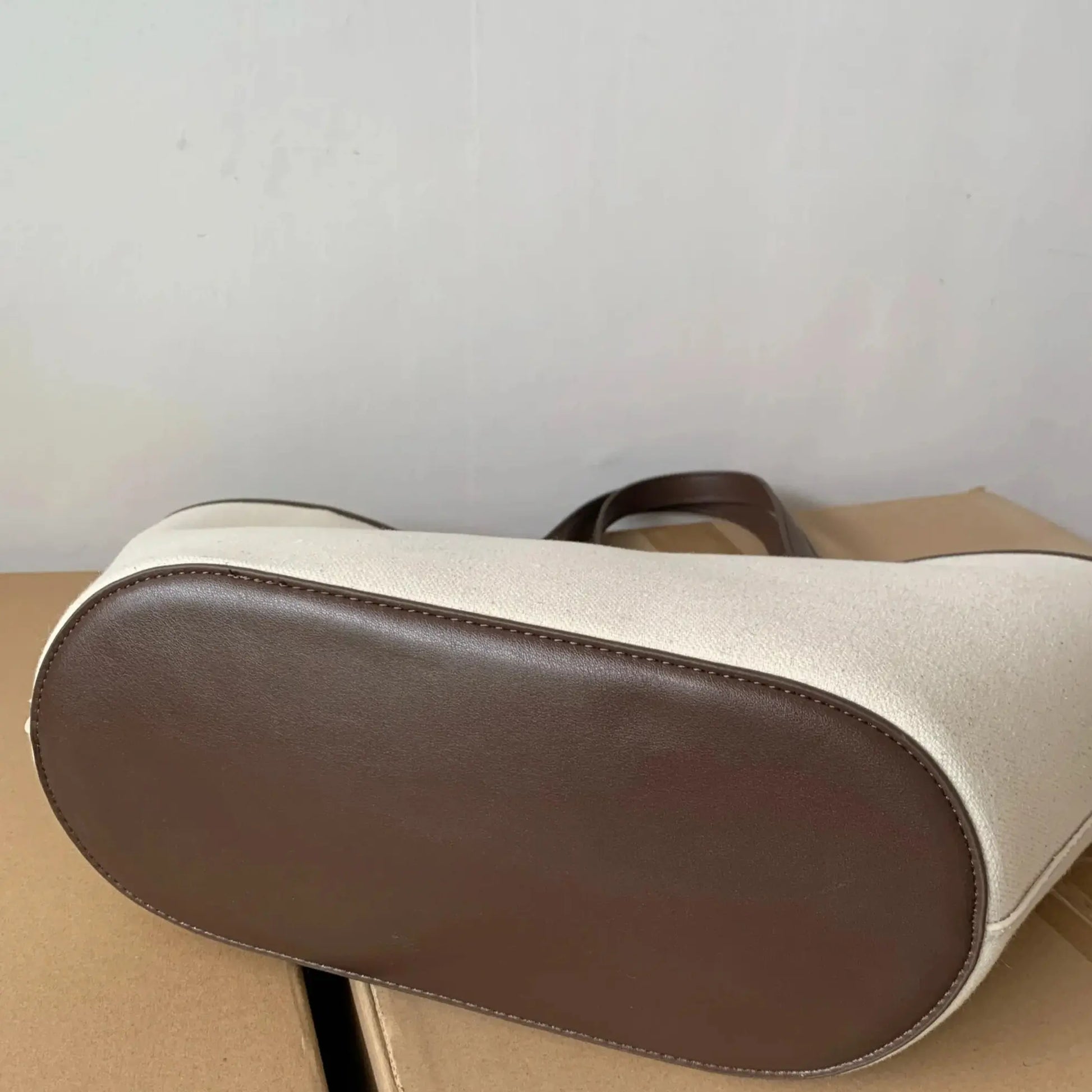 canvas tote bag with synthetic leather trim close-up