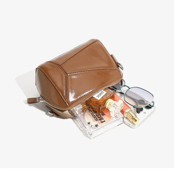 Organised interior with slip, phone and zip pockets — compact capacity