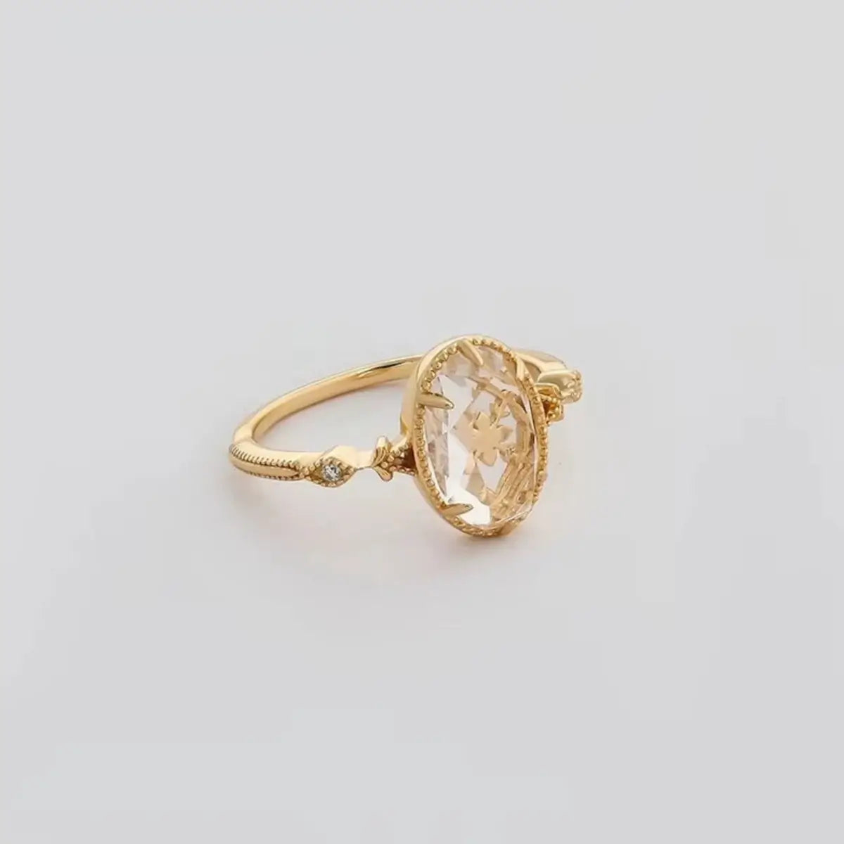 oval centre crystal ring with polished gold vermeil band